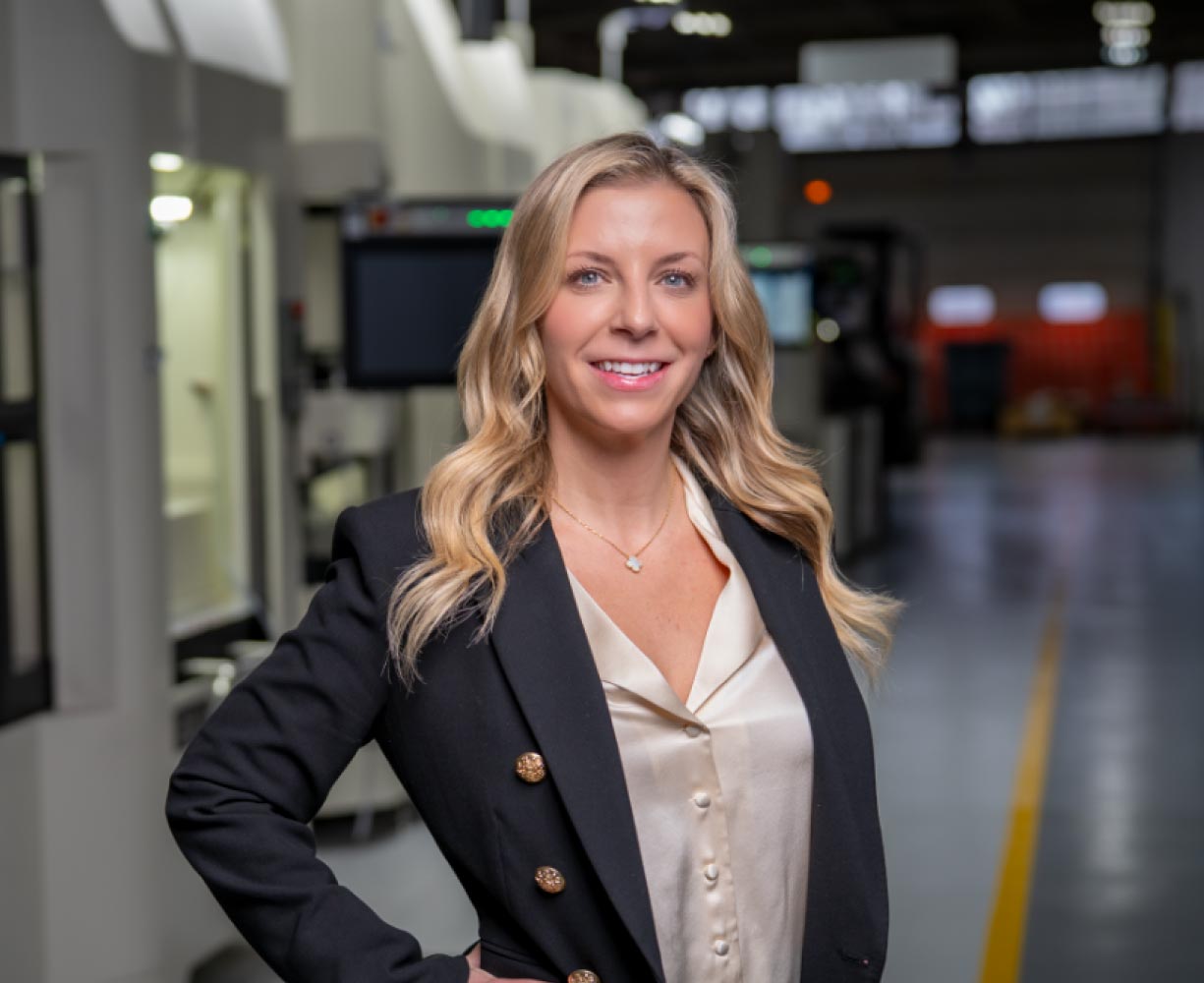 Portrait of Brittany from the Burke Aerospace team in the manufacturing facility