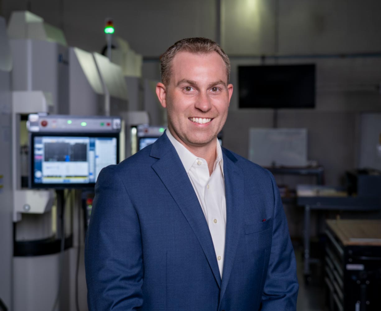 Portrait of Justin from the Burke Aerospace team in the manufacturing facility