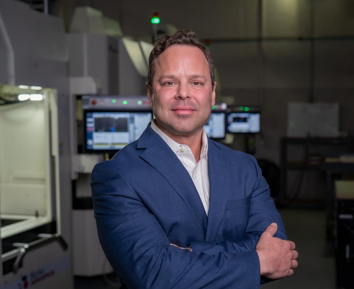 Portrait of Tyler from the Burke Aerospace team in the manufacturing facility